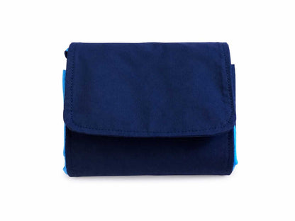 Blue and white fabric market bag folded in pouch position on a white background