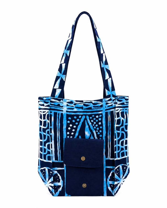 Blue and white patterned tote bag on a white background