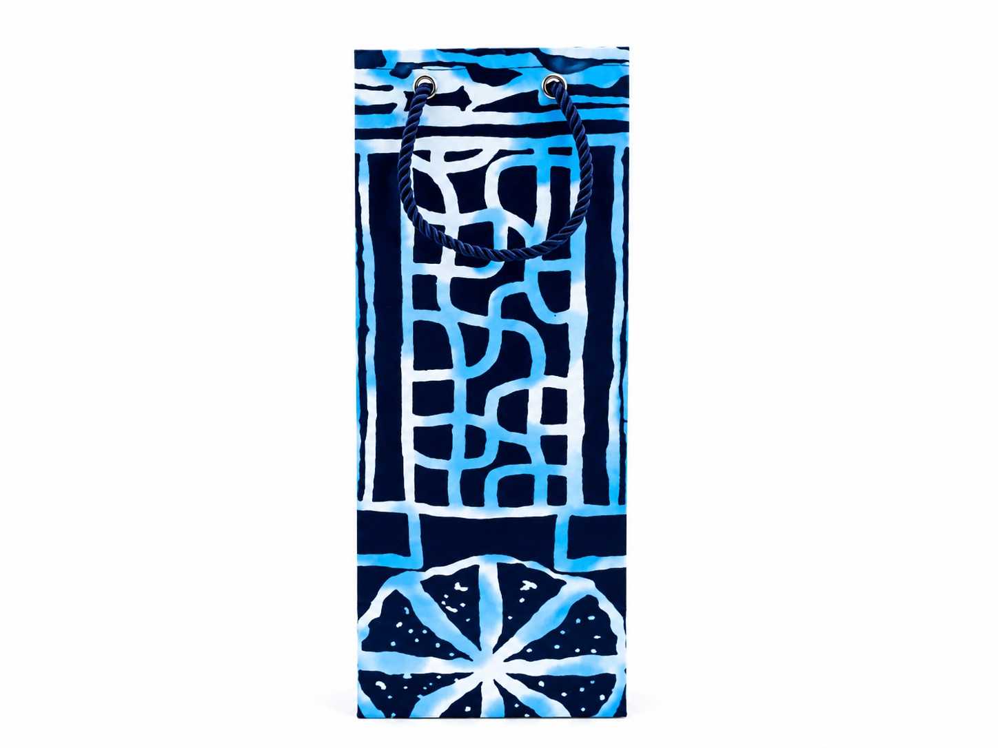 Blue and white patterned bag with handles on a white background