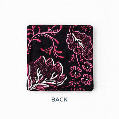 Back view of corner bookmark with black, pink, & white patterns on a light gray background
