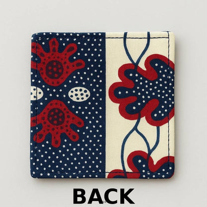 back view of cream corner bookmark with maroon & blue patterns on a light gray background