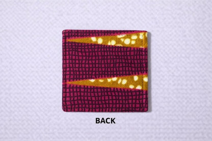 back view of corner bookmark with pink, brown, cream, & gold patterns on a light gray background