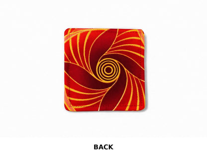back view of red corner bookmark with maroon, pink, & gold patterns on a light gray background