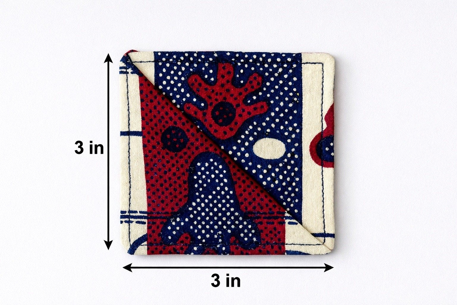 Cream, maroon, & blue corner bookmark with abstract design 3x3 dimensions shown on a light gray background