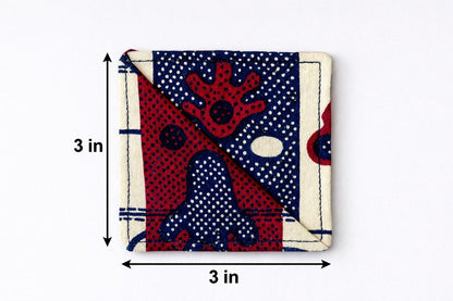 Cream, maroon, & blue corner bookmark with abstract design 3x3 dimensions shown on a light gray background