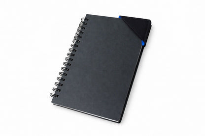 Black spiral-bound notebook with a black, blue, & purple corner bookmark on a light gray background