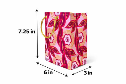 Fuchsia, pink, white, & gold extra small gift bag with abstract design 7.25H in x 6W in x 3D in dimensions shown on a white background