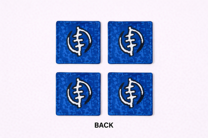 Set of 4 blue, black, & white African fabric coasters on white background