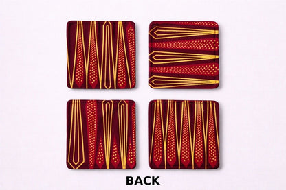 Back view of 4 maroon, red, black, & gold African fabric coasters on white background