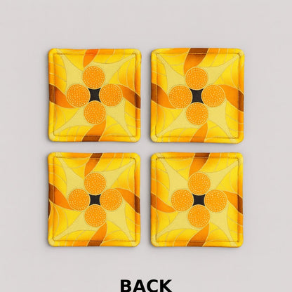 Back view of 4 yellow, brown, orange, & gold African fabric coasters on white background