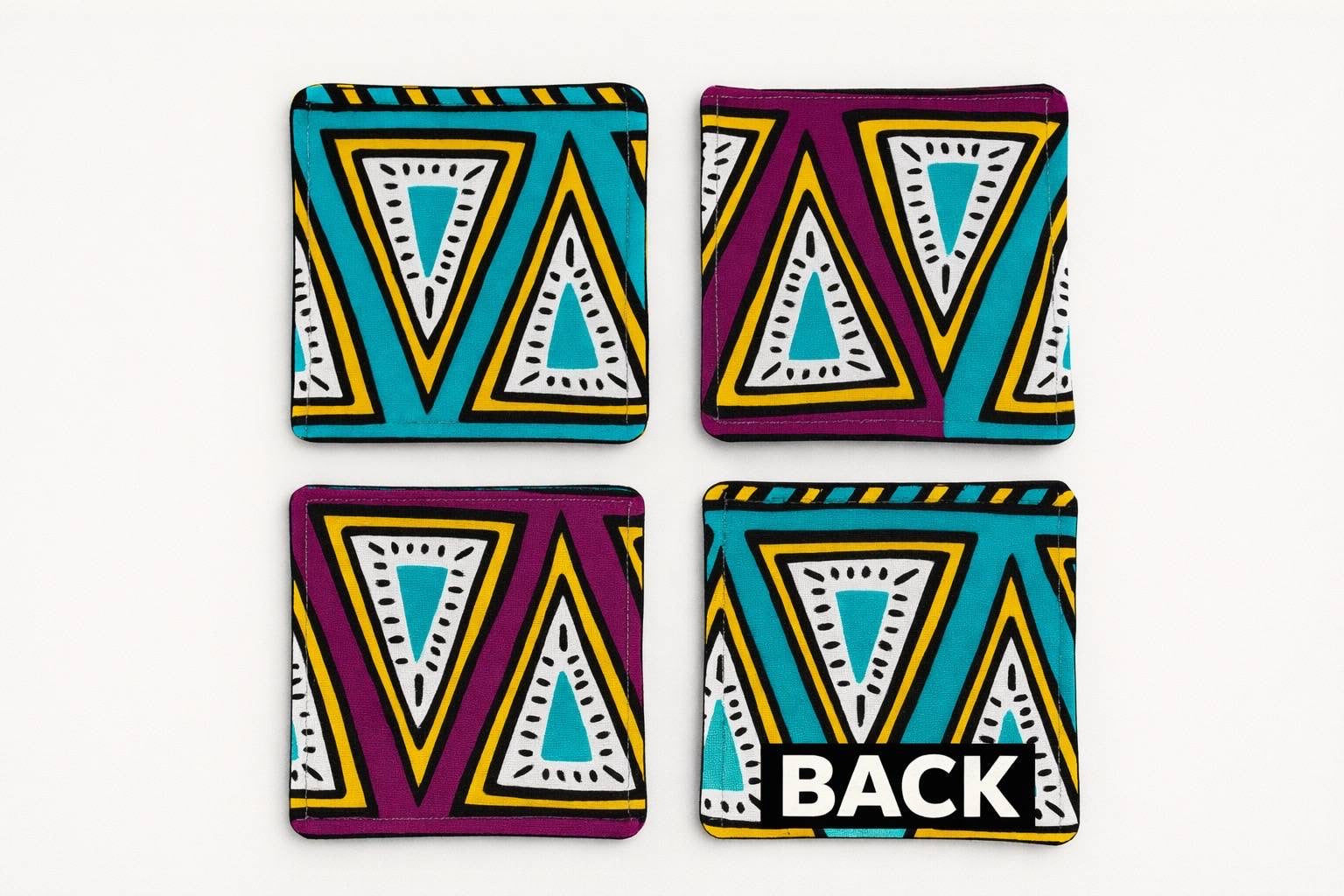 Set of 4 purple, green, yellow, beige, white, & black African fabric coasters on white background