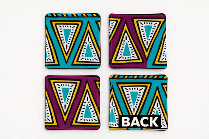 Set of 4 purple, green, yellow, beige, white, & black African fabric coasters on white background