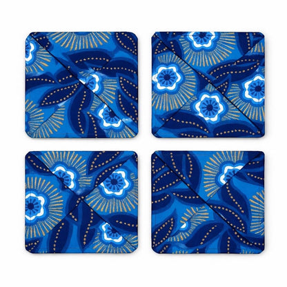 Set of 4 dark blue, blue, white, & gold African fabric coasters on white background