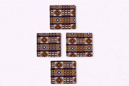 Set of 4 dark brown, orange, & gold African fabric coasters on white background