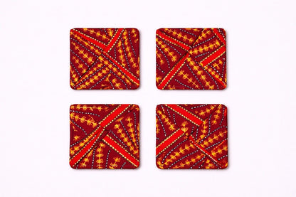 Set of 4 maroon, orange, white & gold African fabric coasters on white background