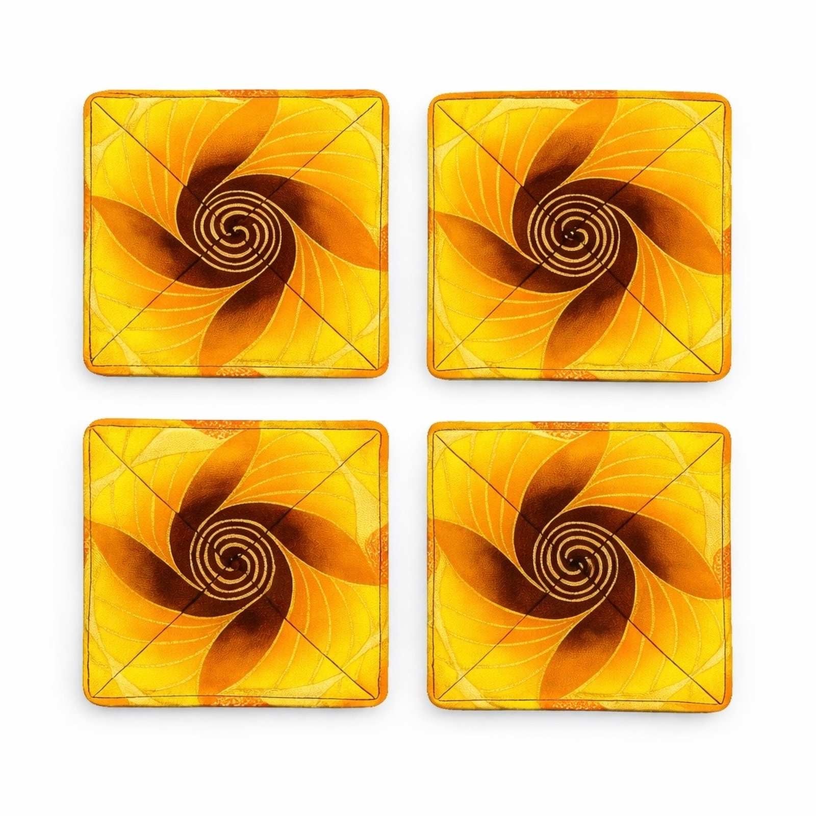 Set of 4 yellow, orange, brown, & gold African fabric coasters on white background