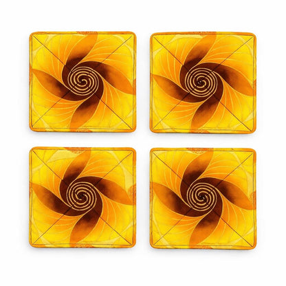 Set of 4 yellow, orange, brown, & gold African fabric coasters on white background