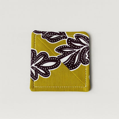 Green, brown, & white corner bookmark on light gray background