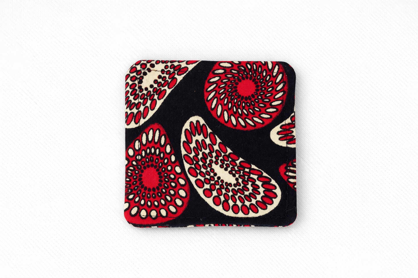 Black, red, & tan corner bookmark on light gray background