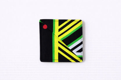 Black, green, yellow, & white corner bookmark on light gray background