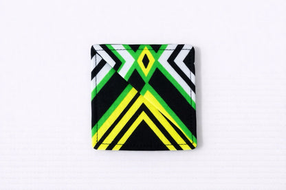 Black, green, white, yelllow corner bookmark on light gray background