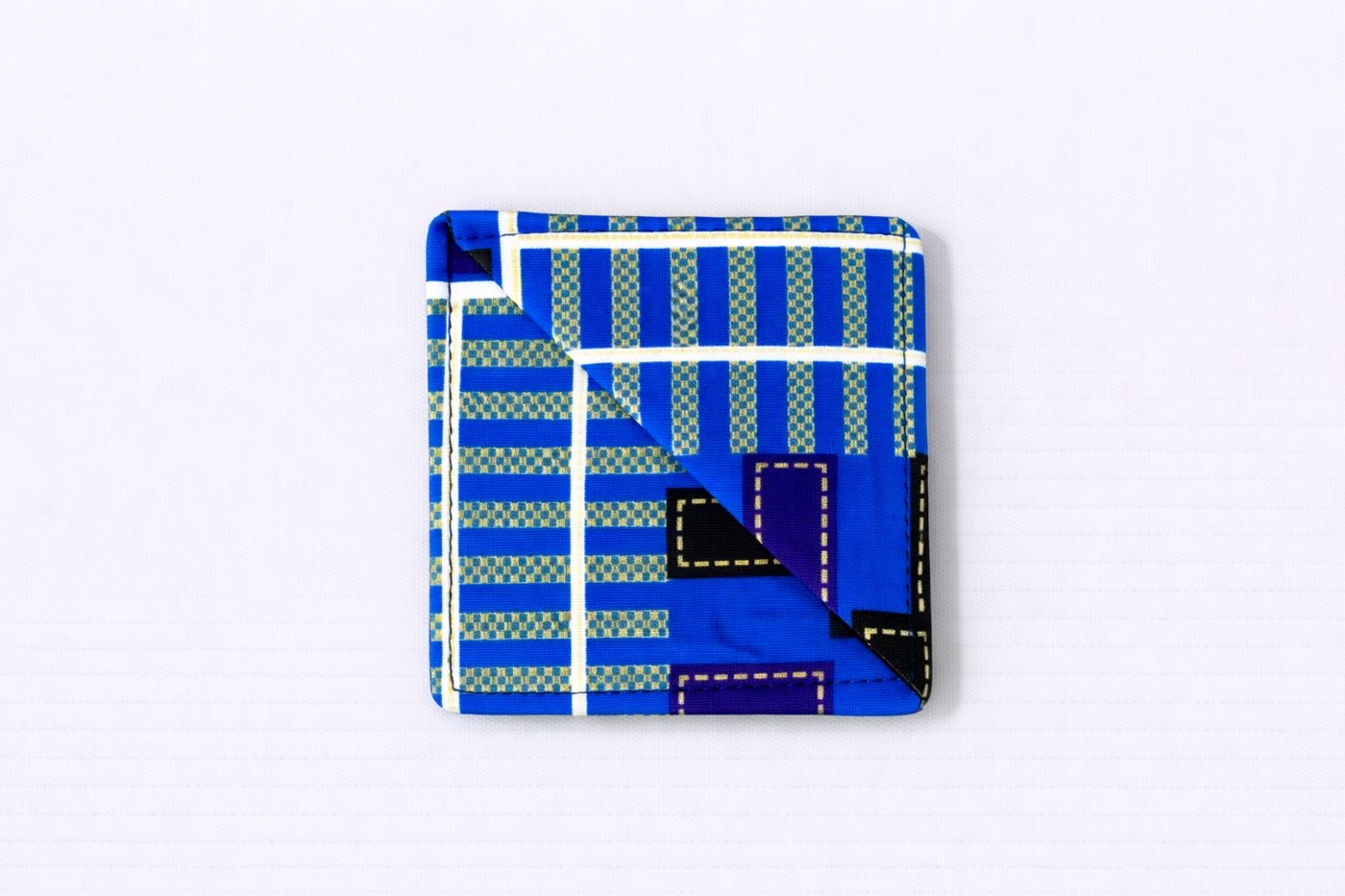 Blue, dark blue, purple, black, white, & gold corner bookmark on light gray background