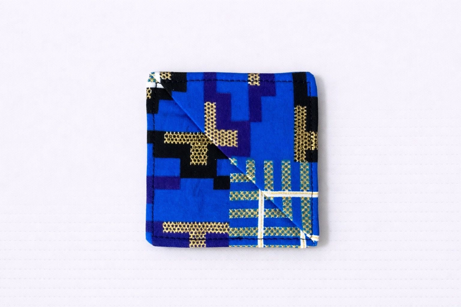 Blue, dark blue, purple, black, white, & gold corner bookmark on light gray background