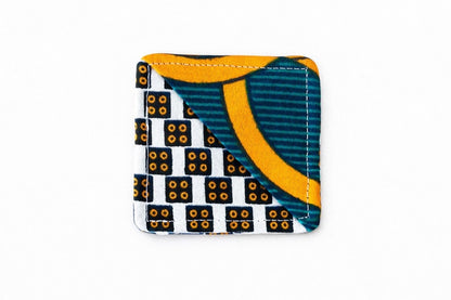 Cream, green, blue, & orange corner bookmark on light gray background