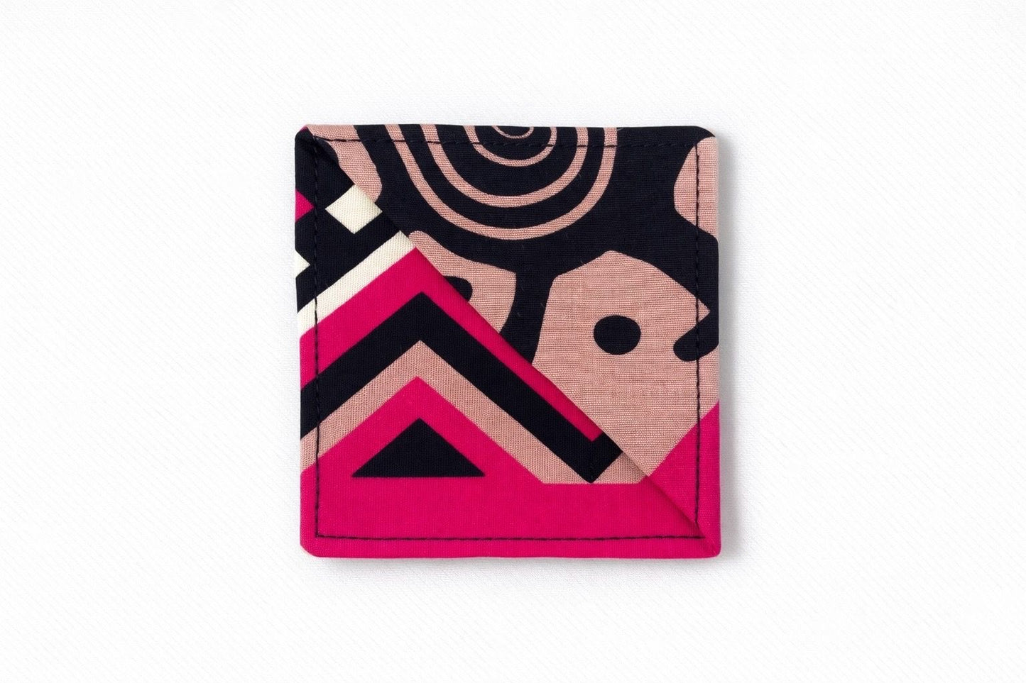 Black, pink, beige, and cream corner bookmark on light gray background