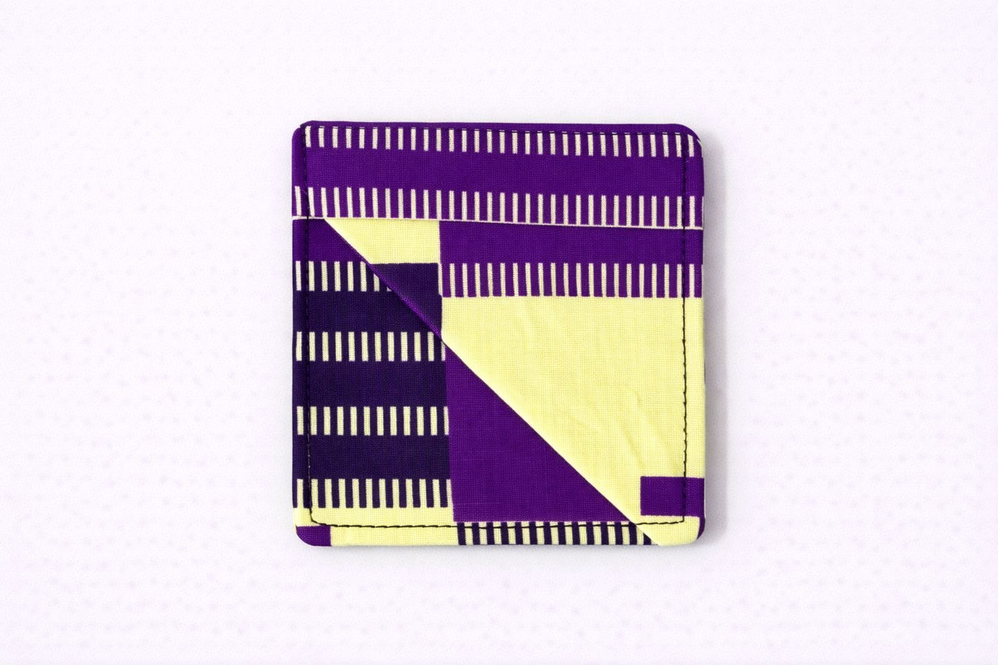 Yellow, purple, & black corner bookmark on light gray background