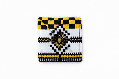 white, black, & gold corner bookmark on light gray background