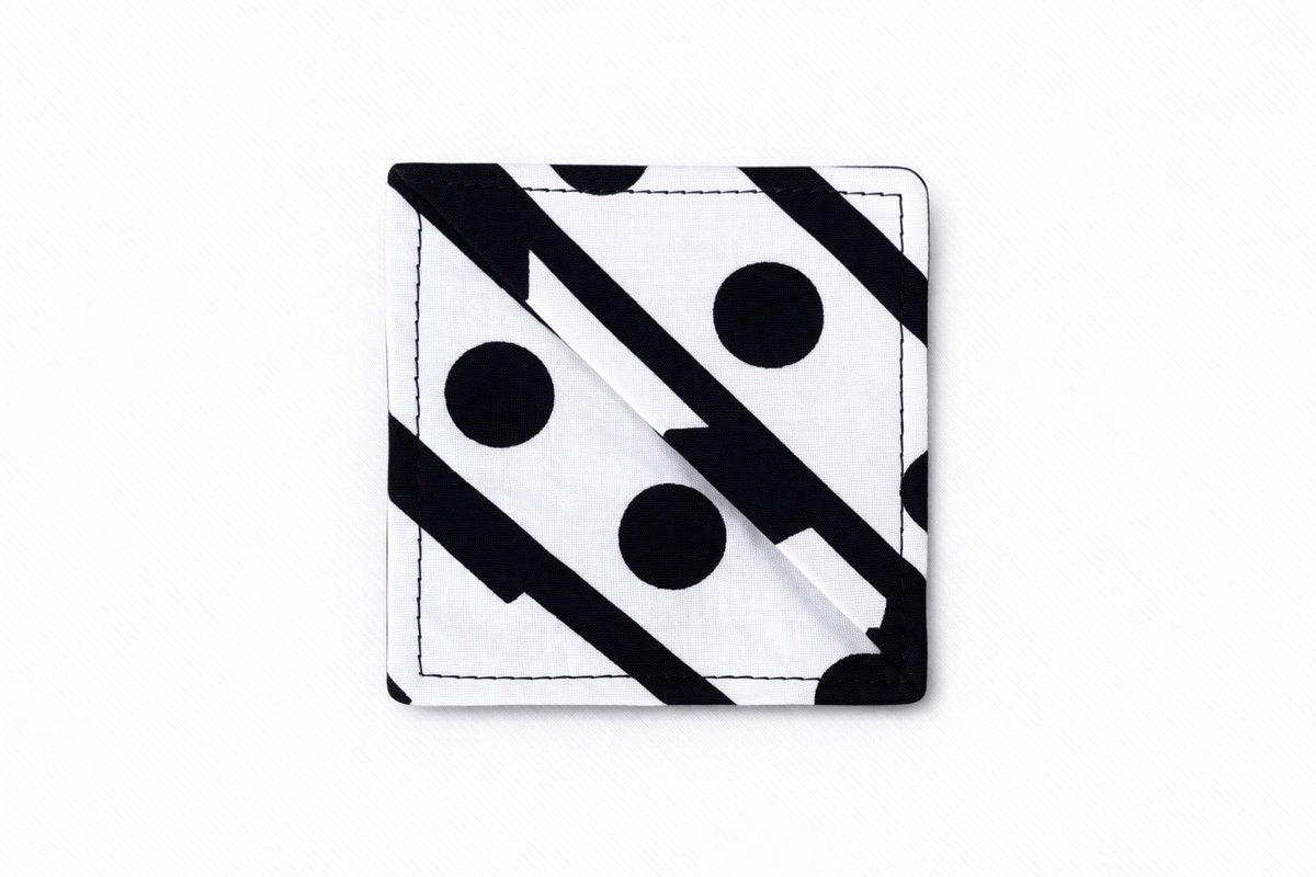 White, red & black corner bookmark on light gray background