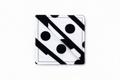 White, red & black corner bookmark on light gray background