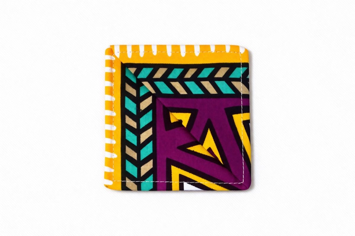 yellow, purple, green, taupe, & white corner bookmark on light gray background 