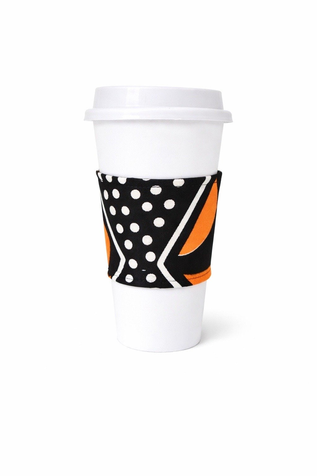 Black, white, & orange African wax print cup sleeve on coffee cup