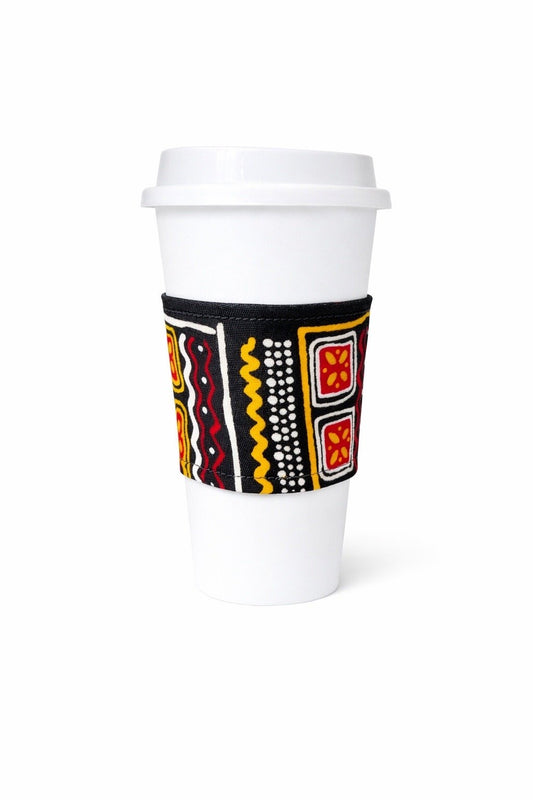 Black, white, yellow, & red African wax print cup sleeve on coffee cup