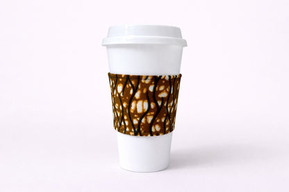 Cream, dark blue, brown, red, white African wax print cup sleeve on coffee cup