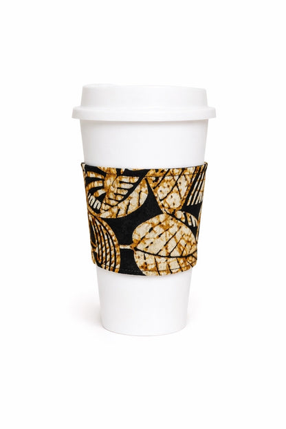 Gold, black, & cream African wax print cup sleeve on coffee cup