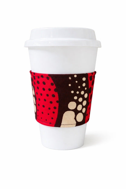 Red, cream, & dark brown African wax print cup sleeve on coffee cup