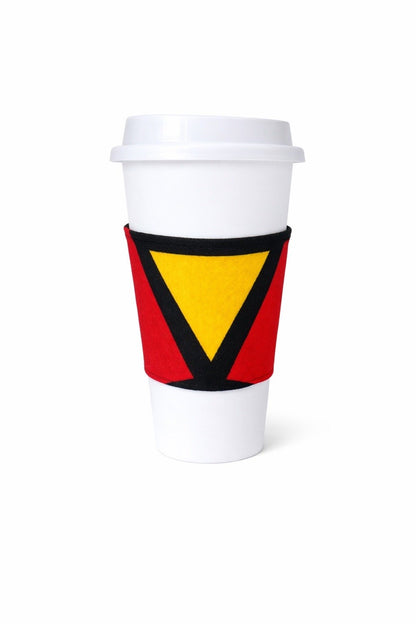 Red, yellow, black, & white African wax print cup sleeve on coffee cup