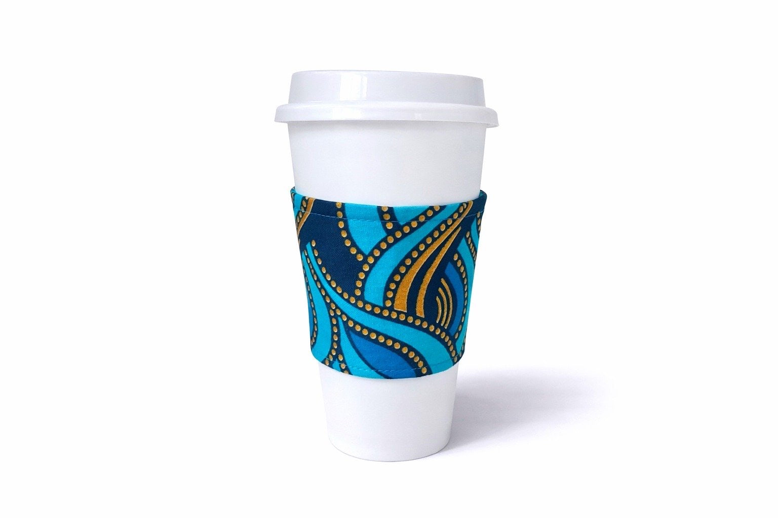 Turquoise, dark blue, & gold African wax print cup sleeve on coffee cup