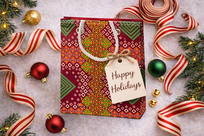Red, orange, yellow, green, & white extra small gift bag with Christmas decorations on white background
