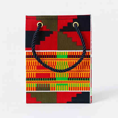 Orange, red, green, black, & white extra small gift bag on white background