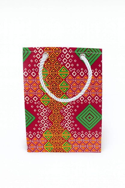Red, orange, yellow, green, & white extra small gift bag on white background