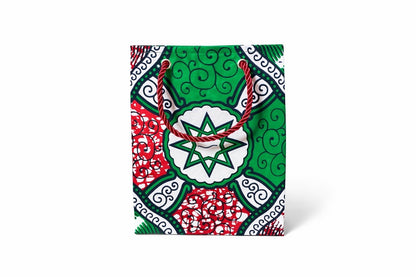 White, green, red, & black extra small gift bag on white background