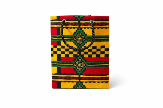 Yellow, red, green, black, & gold extra small gift bag on white background