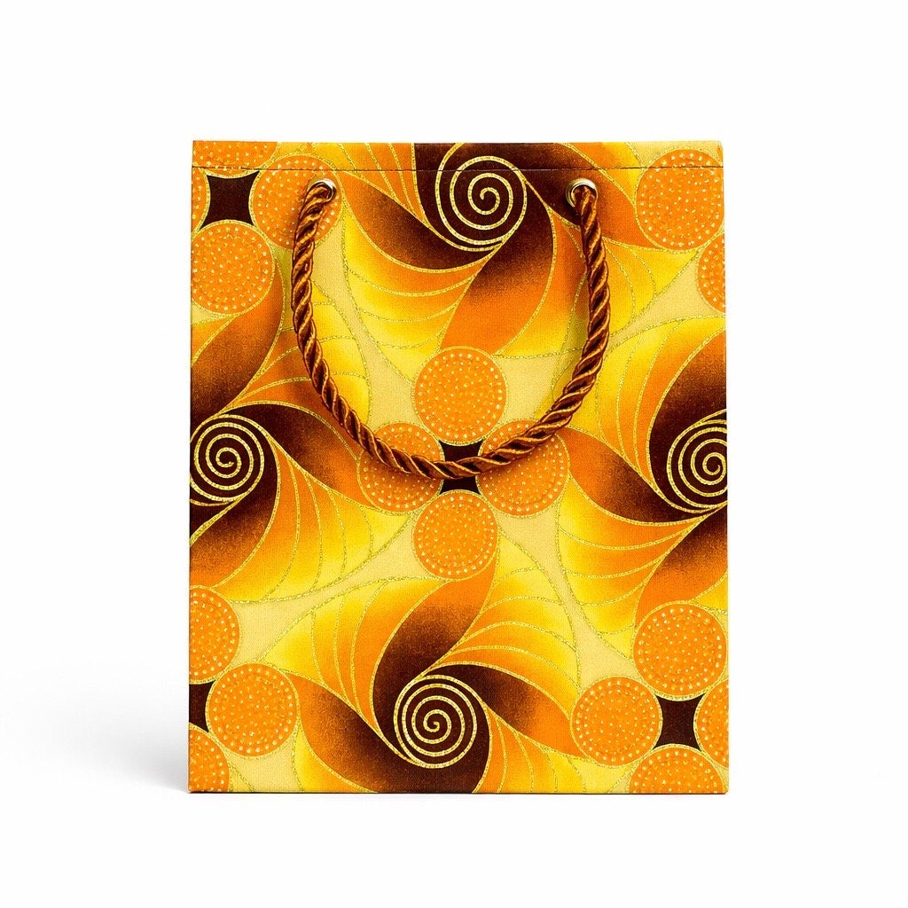 Yellow, brown, orange, & gold extra small gift bag on white background