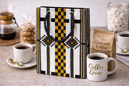 White, black, & gold handmade African fabric extra small gift bag in lifestyle shot