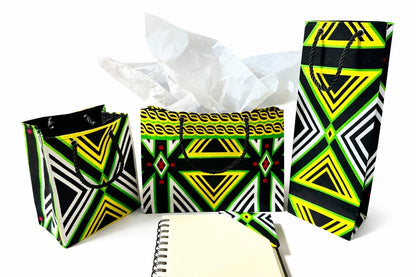 Black, green, yellow, & white small horizontal bag, wine bag, corner bookmark, & extra small gift bag on a white background