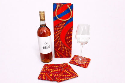 Maroon, blue, orange, white, & gold wine bag, & coaster set on a white background
